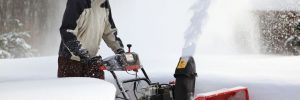 Man Snow Blowing