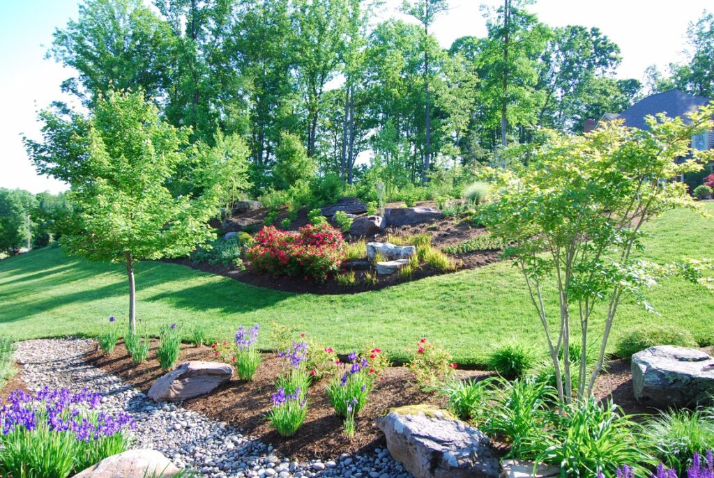 Hillside Landscape with Trees and Flowerbeds