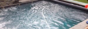 Professional custom-built spa in backyard